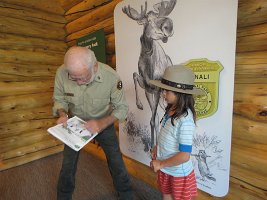 IMG 6302  Ranger checking Megan's Junior Ranger Book, Denali National Park Main Visitor Center