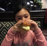 IMG_3561 Megan eating a breakfast sandwich, Brighthouse Breakfast and Burgers, Plaza Hotel, Las Vegas, NV
